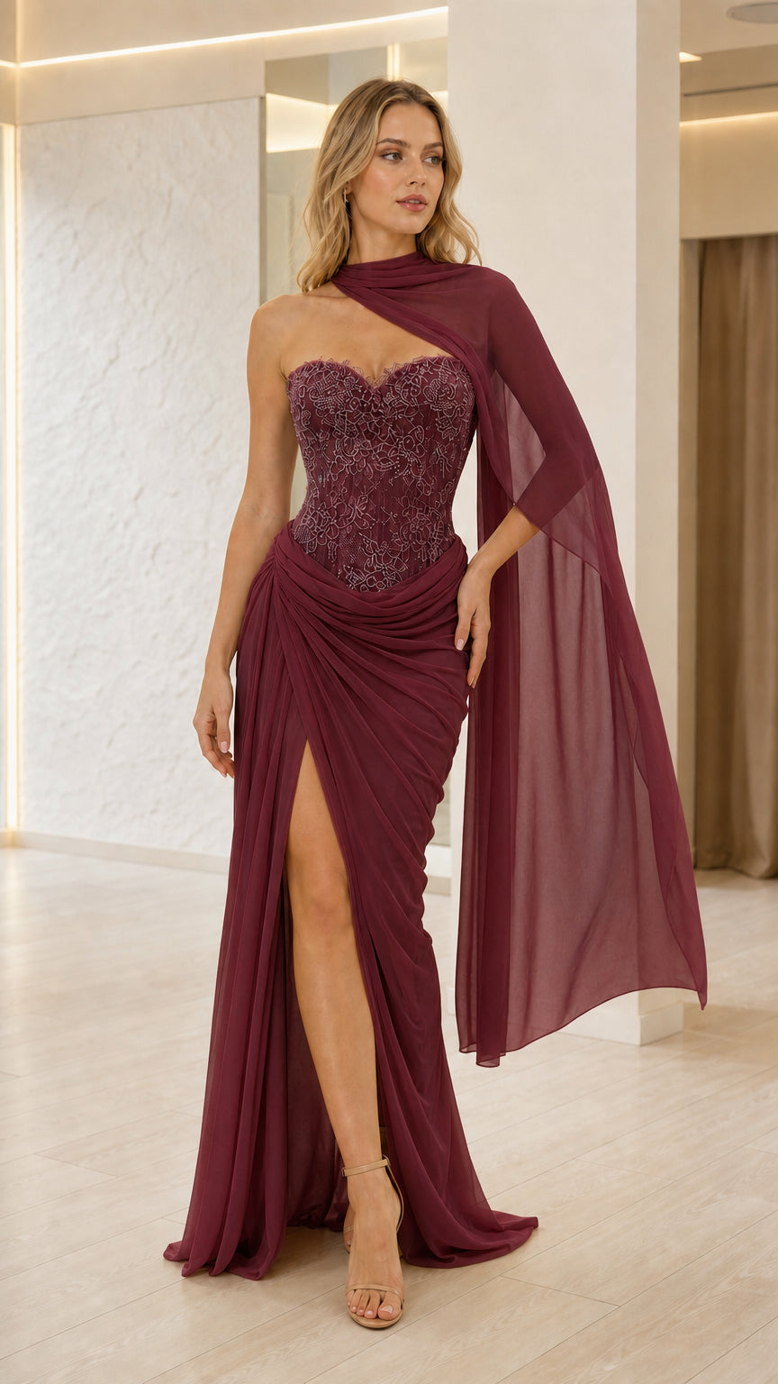 Burgundy lace corset maxi dress with sheer cape and side slit