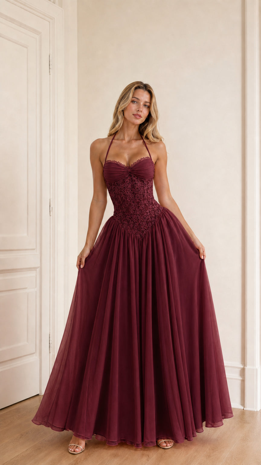 Model wearing burgundy evening dress front view