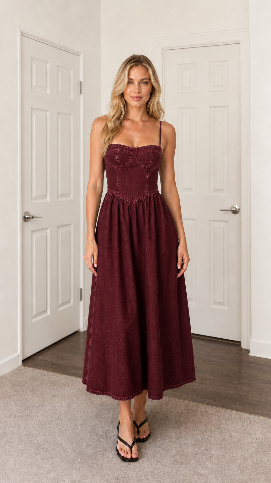 Front view of woman wearing burgundy denim midi dress