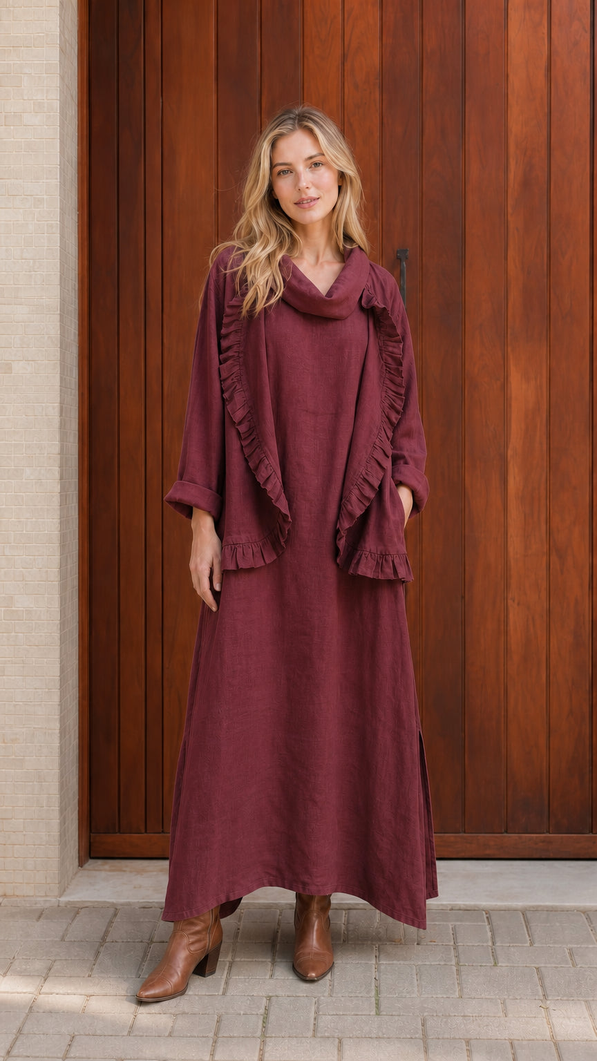Model wearing burgundy ruffled cowl neck top and maxi skirt set