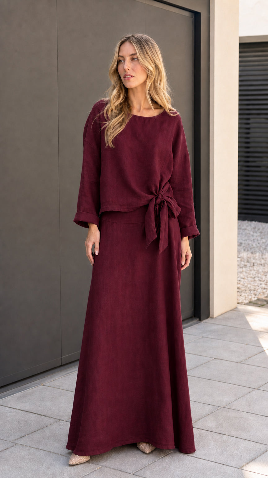 Model wearing burgundy two-piece matching set