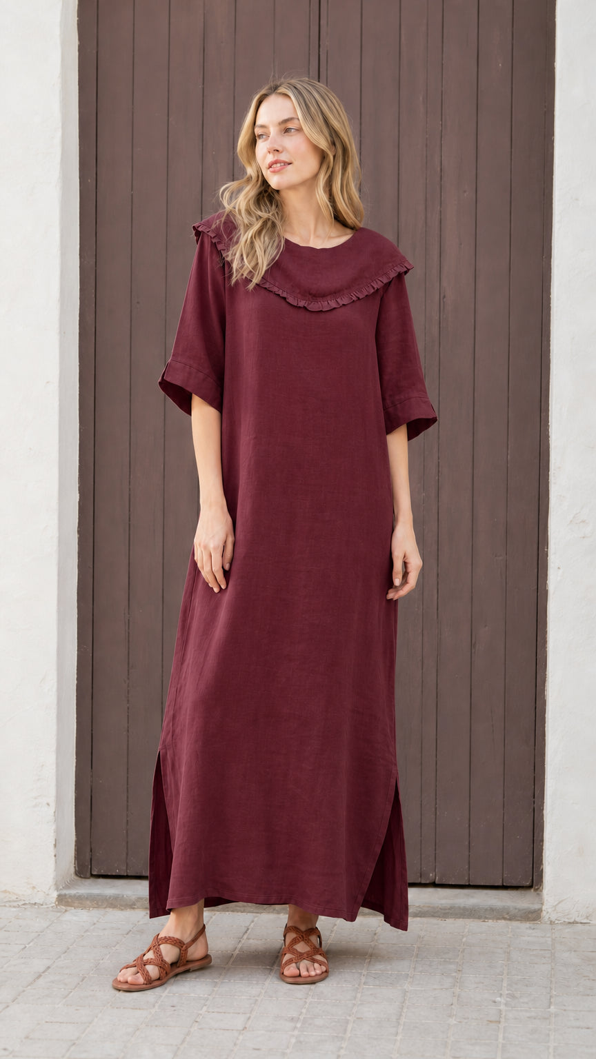 Front view of woman wearing burgundy relaxed-fit maxi dress