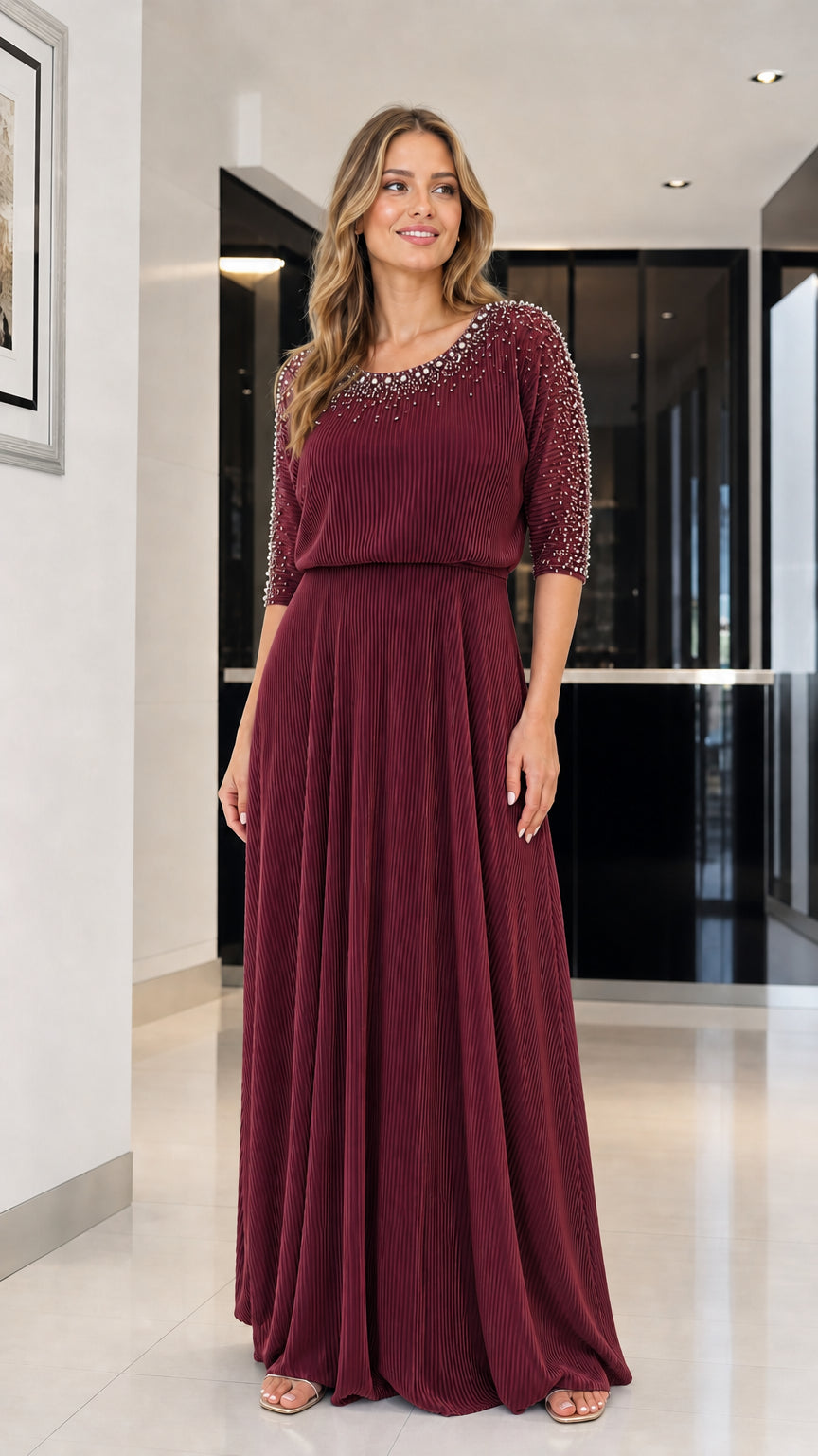 Model wearing burgundy beaded pleated maxi dress