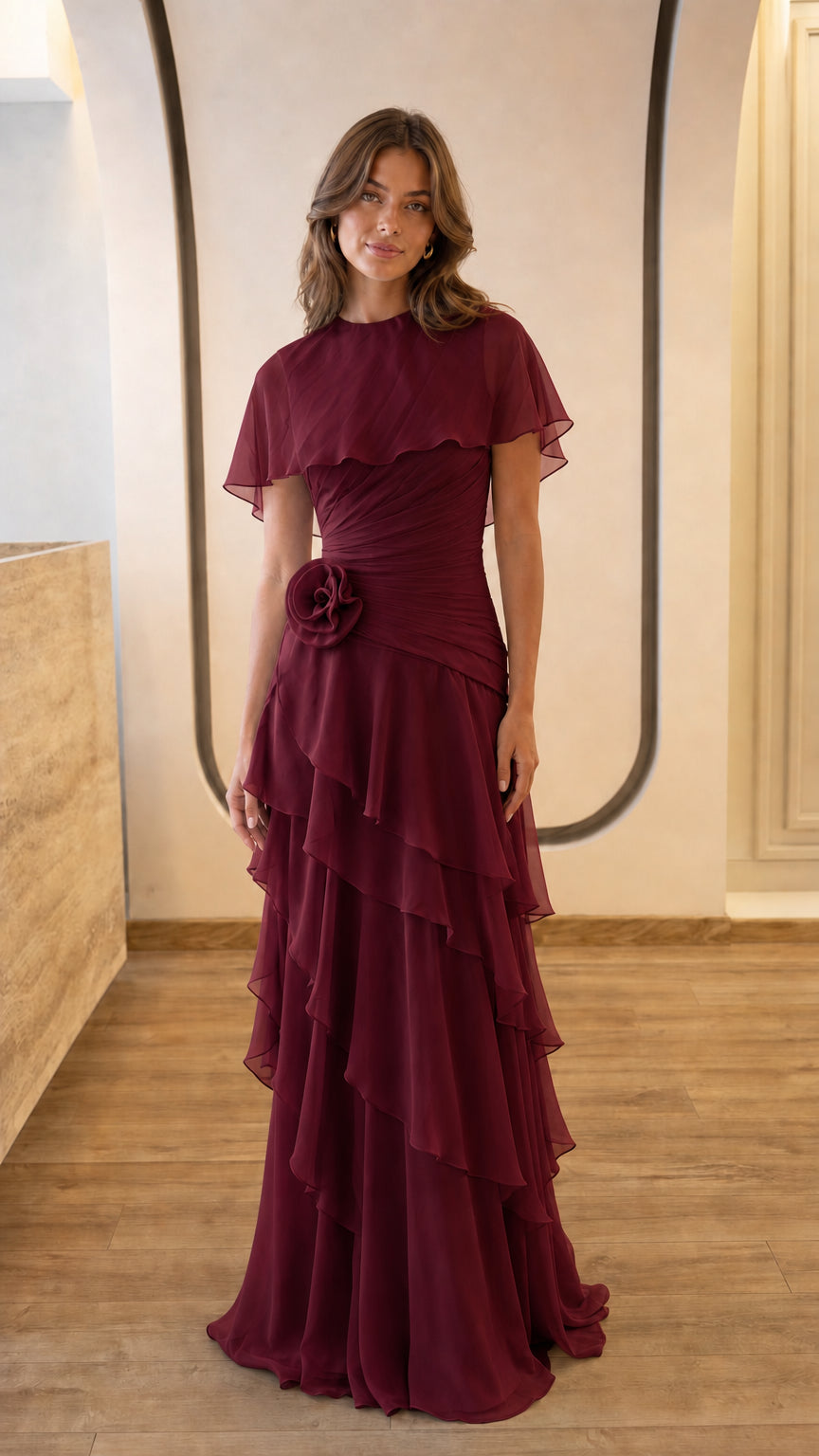 Full view of burgundy evening gown with floral accent