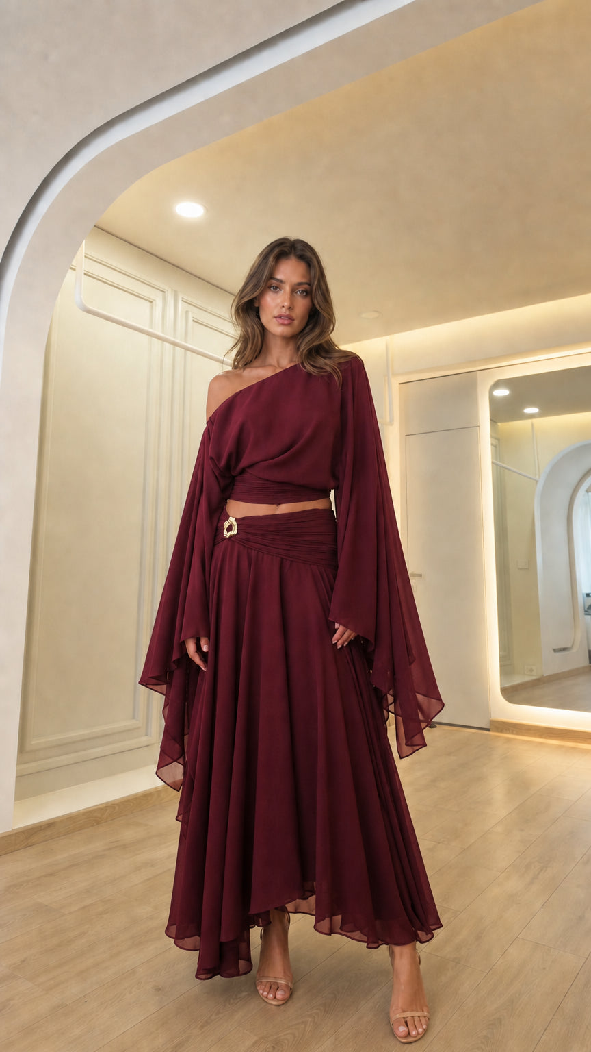 Woman wearing the burgundy color variant of the elegant evening set