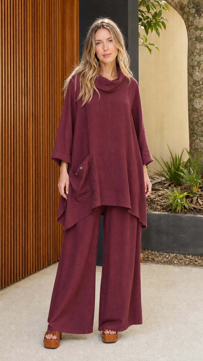 Model wearing burgundy cowl neck tunic and wide leg pants set
