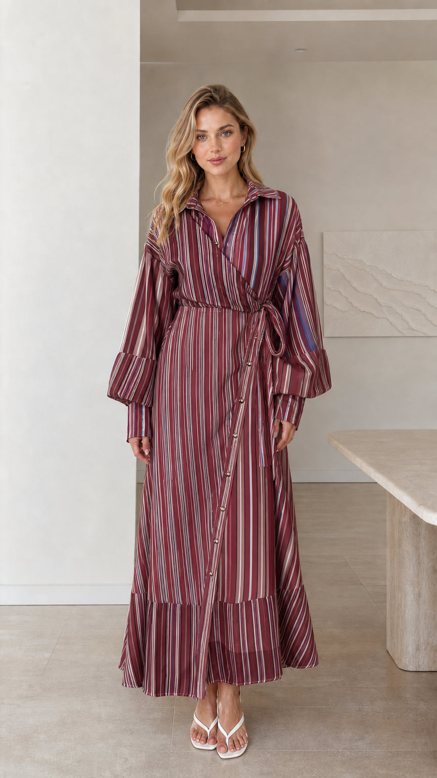 Model wearing burgundy striped wrap maxi dress