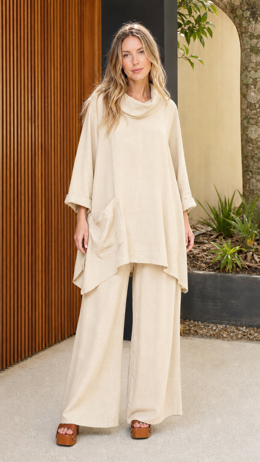 Model wearing beige cowl neck tunic and wide leg pants set